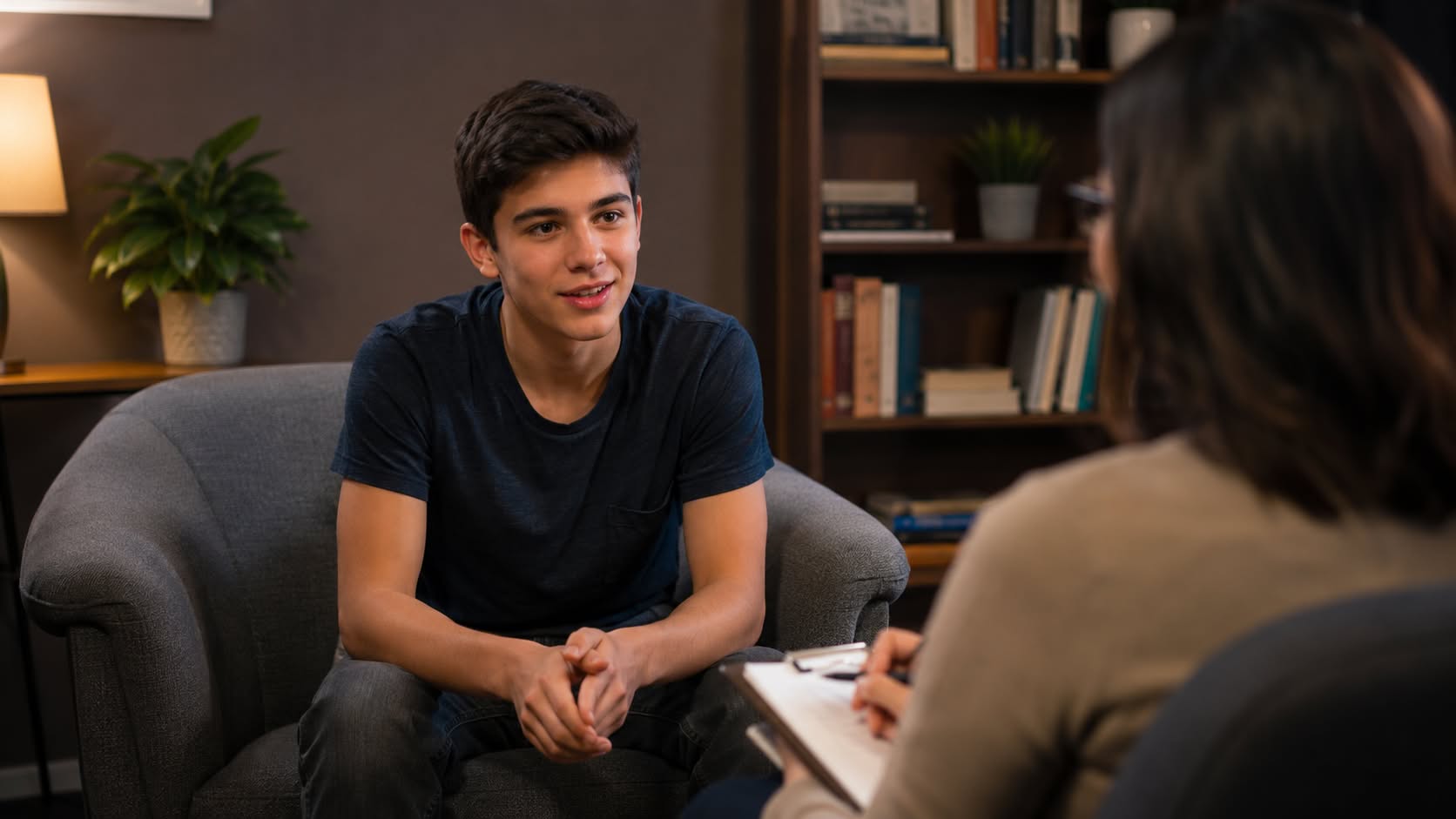 Teen sitting comfortably in a teen therapy session with a counselor at Davis-Smith Mental Health in New Lenox, IL